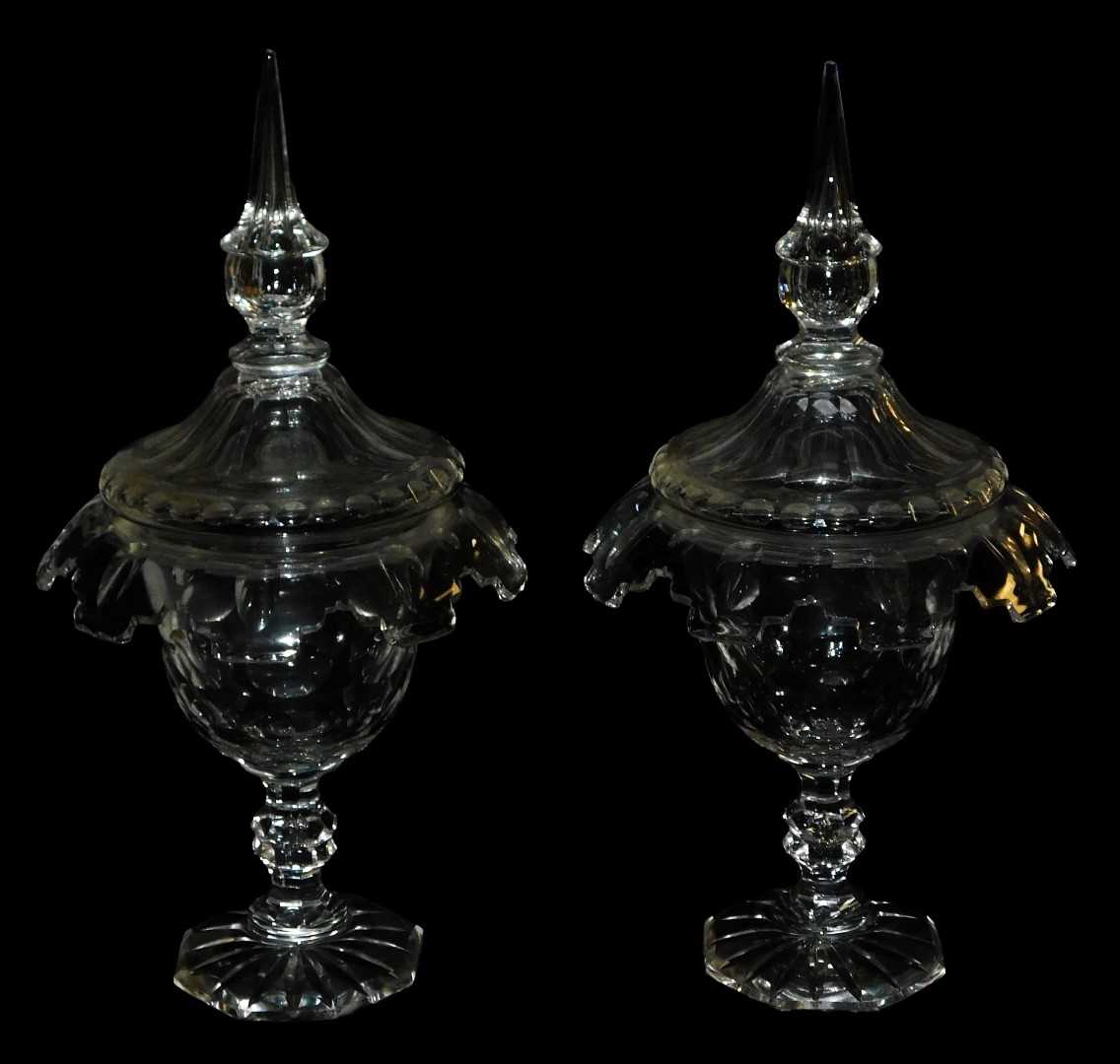 Lot 43 - A pair of 19thC cut glass sweetmeat jars and...