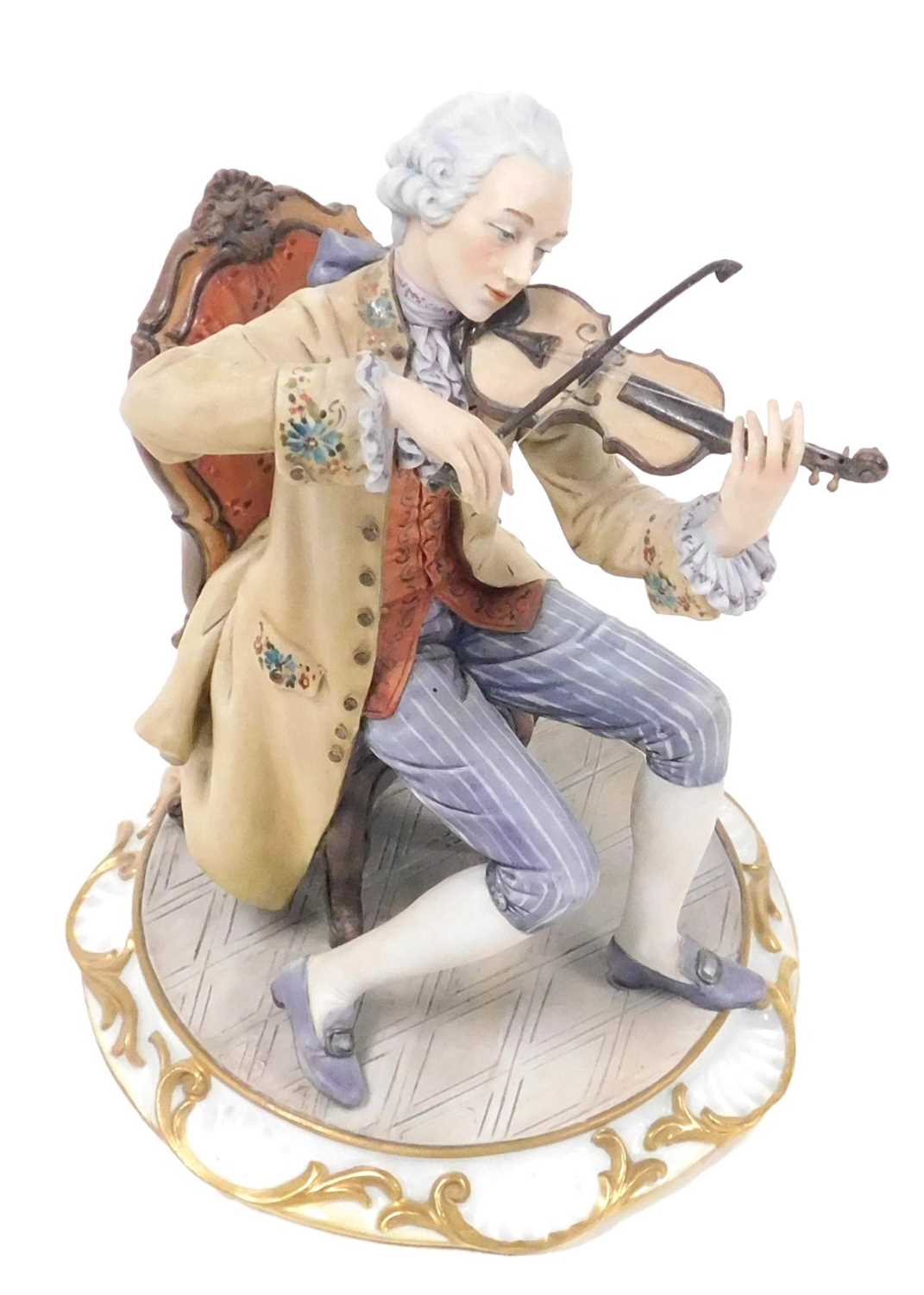 Lot 49 - A Capodimonte porcelain figure of a violinist,...