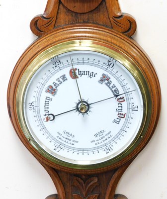 Lot 85 - A Victorian oak cased wheel barometer, with a...