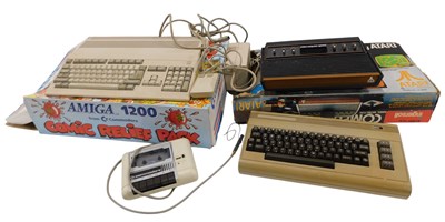 Lot 223 - An Atari model number CX-2600 games console, a...