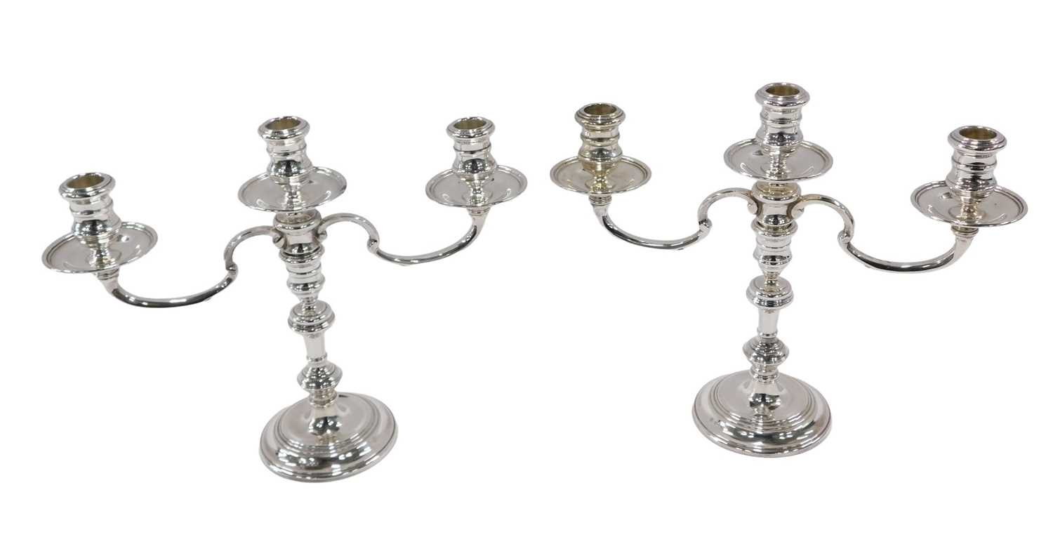 Lot 4 - A pair of Elizabeth II three branch silver...