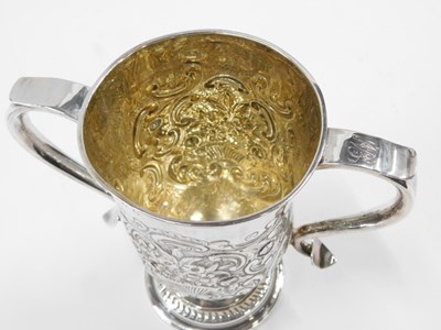 Lot 17 - A George IV silver two handled cup, later...