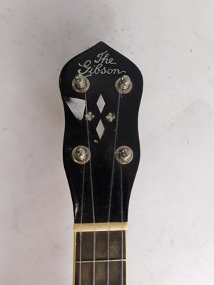 Lot 20 - A walnut and mother of pearl inlaid ukulele...