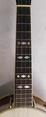 Lot 20 - A walnut and mother of pearl inlaid ukulele...