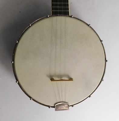 Lot 20 - A walnut and mother of pearl inlaid ukulele...