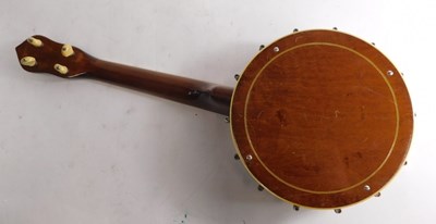 Lot 20 - A walnut and mother of pearl inlaid ukulele...