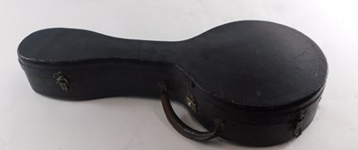 Lot 20 - A walnut and mother of pearl inlaid ukulele...