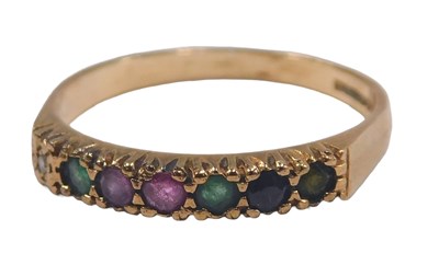 Lot 83 - A 9ct gold and seven stone 'dearest'...