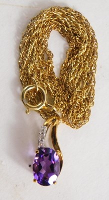 Lot 55 - A 9ct gold amethyst and diamond pendant, with...