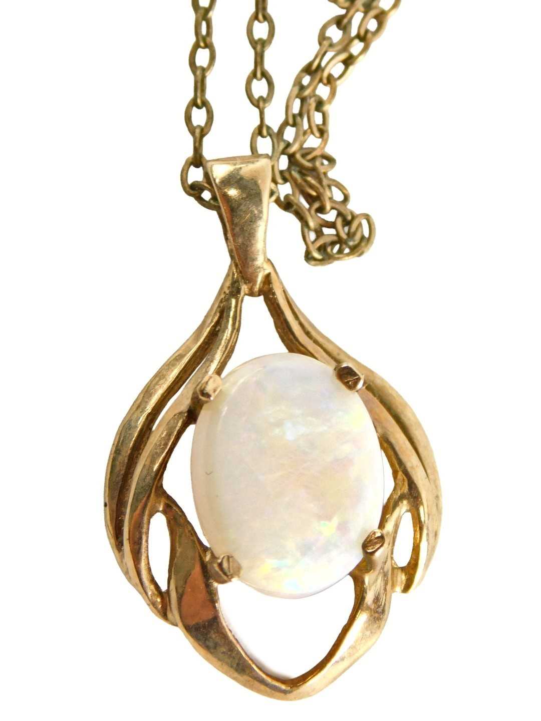 Lot 51 - A 9ct gold and opal pendant, on a fine link...