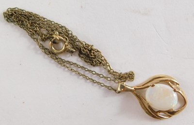 Lot 51 - A 9ct gold and opal pendant, on a fine link...