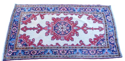 Lot 939 - A Persian cream ground rug, with floral...