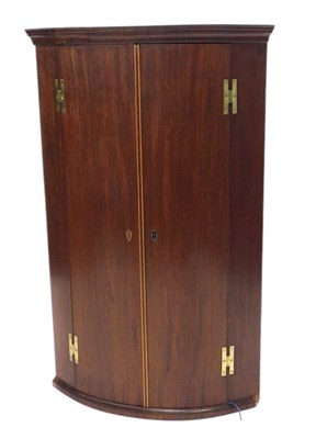 Lot 929 - A 19thC mahogany bowfronted corner cabinet,...