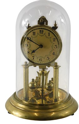 Lot 742 - A German brass anniversary clock, with glass...