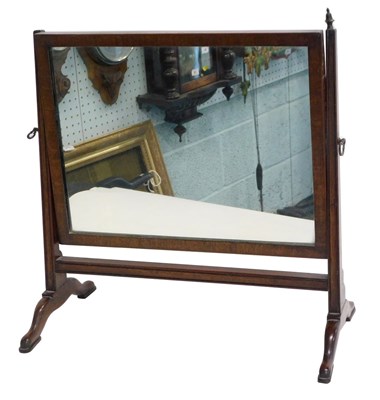 Lot 958 - A mahogany swing frame dressing mirror, on...