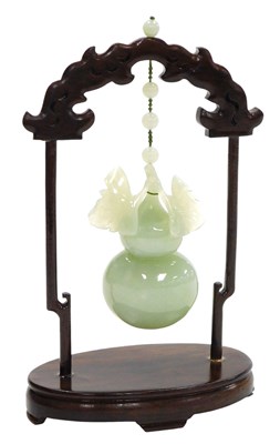 Lot 31 - A 20thC Chinese jade carving of a gourd, with...