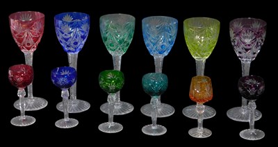 Lot 50 - A set of six Bohemian cut coloured glass wine...