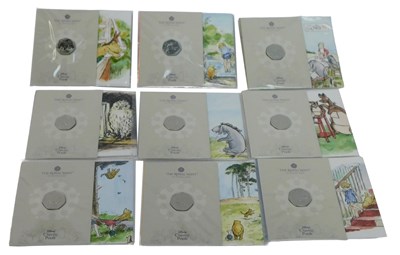 Lot 129 - Nine Royal Mint Disney Classic Pooh fifty...