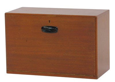 Lot 506 - A mid-20thC teak table cabinet, the front with...