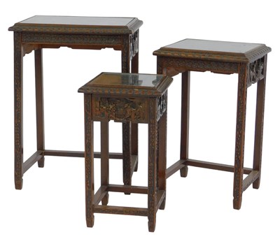 Lot 539 - An Oriental carved hardwood nest of occasional...
