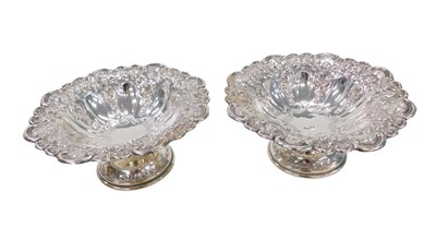 Lot 107 - A pair of Edward VII silver pedestal dishes,...