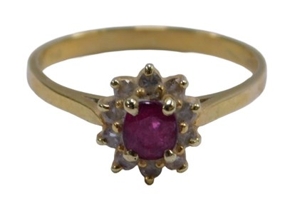 Lot 566 - An 18ct gold ruby and diamond floral cluster...
