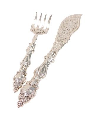 Lot 176 - A set of William IV silver fish servers, with...