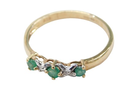 Lot 463 - A 9ct gold emerald and diamond dress ring, set...