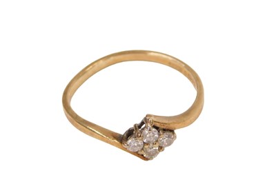 Lot 297 - A 9ct gold dress ring, set with four tiny...