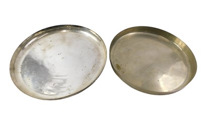 Lot 385 - Two Indian silvered brass trays, one stamped...