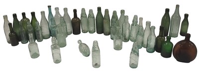 Lot 408 - A group of glass bottles, comprising some with...