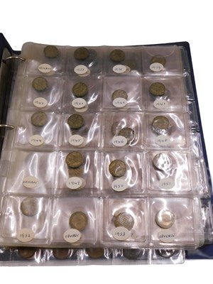 Lot 600 - An album containing mixed English coins, to...