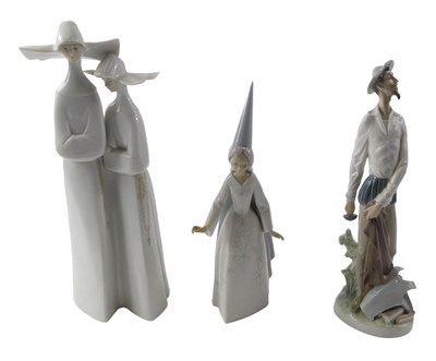 Lot 695 - Lladro porcelain figures, comprising two nuns,...