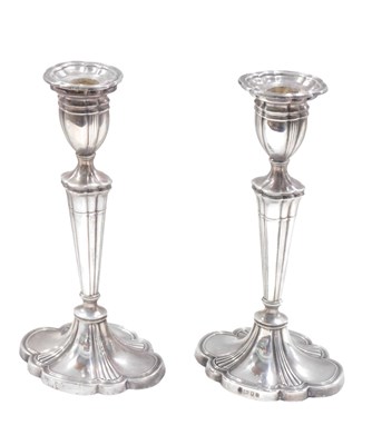 Lot 585 - A pair of Elizabeth II silver candlesticks,...