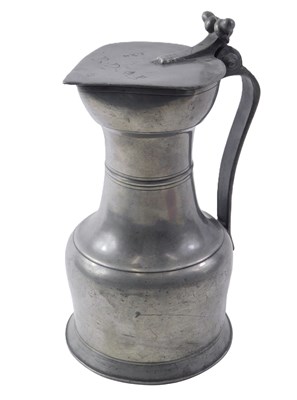 Lot 513 - A 19thC pewter lidded flagon, with moulded...