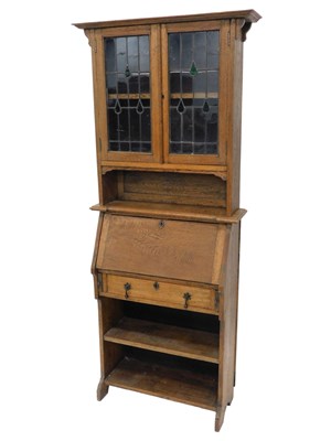 Lot 1051 - An early 20thC oak student's bureau bookcase,...