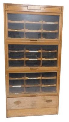 Lot 12 - An early-to-mid 20thC light oak haberdashery...