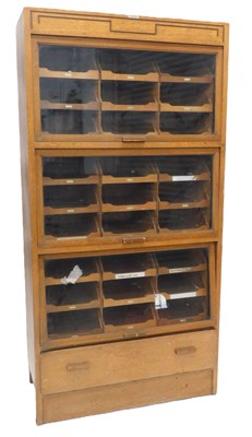 Lot 13 - An early-to-mid 20thC light oak haberdashery...