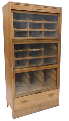 Lot 14 - An early-to-mid 20thC light oak haberdashery...