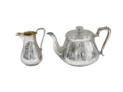 Lot 654 - A Victorian silver teapot, with engraved...
