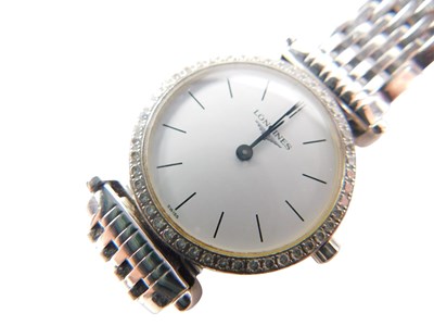 Lot 31 - A Longines ladies wristwatch, with a diamond...