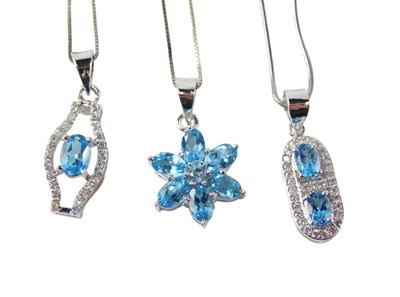 Lot 561 - Three Gems TV pendants and chains, each set...