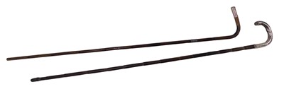 Lot 736 - Two walking canes, one with silver collar,...