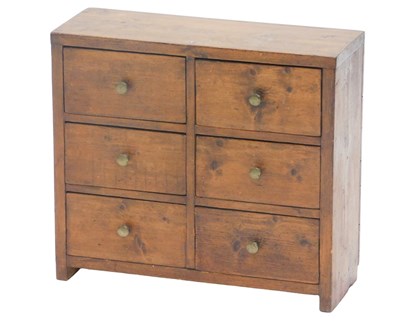 Lot 948 - A small set of stained pine drawers, of rustic...