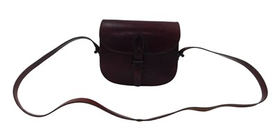 Lot 769 - A brown leather bag and strap, stamped Lopez,...