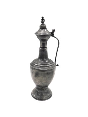 Lot 386 - A 19thC French pewter wine flagon, the domed...