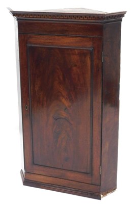 Lot 635 - An early 19thC mahogany hanging corner cabinet,...