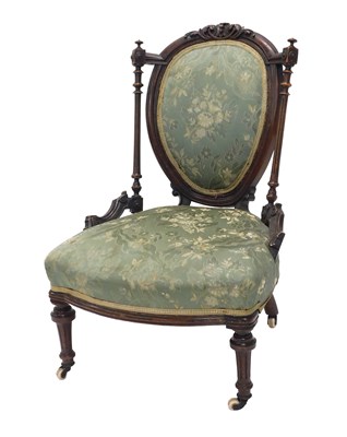 Lot 659 - A Victorian walnut nursing chair, the carved...