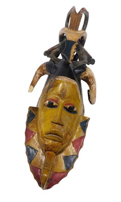 Lot 203 - A Guru tribal mask, Ivory Coast, 64cm high.