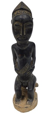Lot 212 - A Baule tribal figure, Ivory Coast, 39cm high.